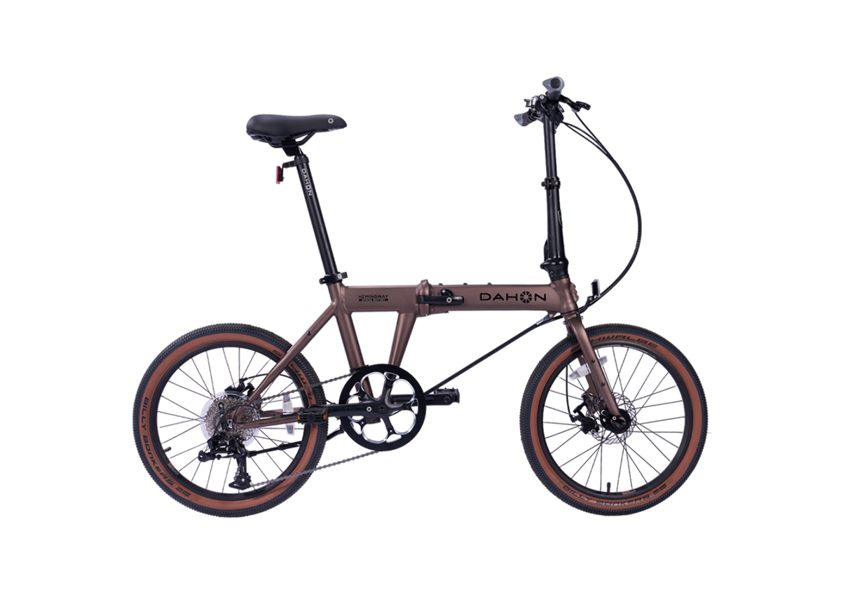 Hemingway GR Dahon folding bike in rust metallic, suitable for city and park trails.