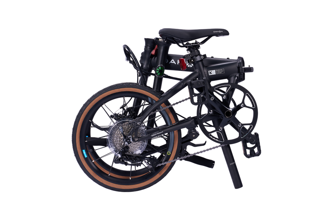 Black DELTECH K9 Ultralight 3-Speed folding bike with tan wall tires.